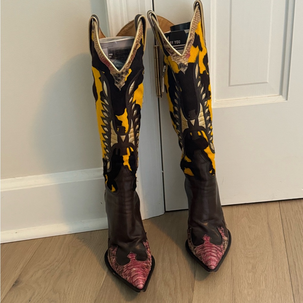 Tall Cowboy boots by Gianmarco Lorenzi.